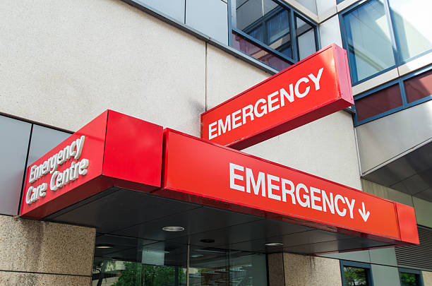 Entrance to hospital emergency department at St Vincent's Hospital in Melbourne, Australia. The sign is red with the word EMERGENCY prominently displayed. It can be used to illustrate various healthcare, medical and emergency concepts, from afflictions such as stroke or heart attack, diseases such as HIV or cancer, and accidents such as road trauma or sporting injury.