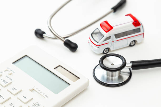 Ambulance, calculator and stethoscope. Ambulance, calculator and stethoscope.